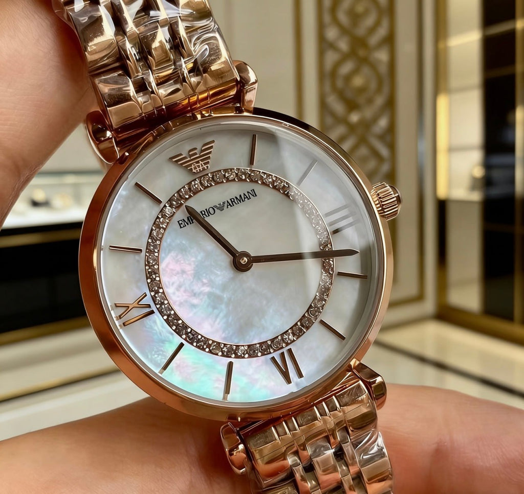 Emporio Armani AR1909 Mother of Pearl Dial Crystal Inner Bezel Roman Numeral Rose Gold Bracelet Ladies Watch
